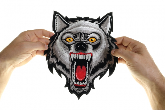 Wolf Patch, Large Animal Patches for Jackets shown on hand for size comparison