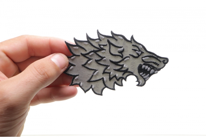 Sideways Wolf Iron on Biker Patch shown on hand for size comparison