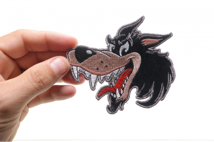 Small Cartoon Wolf Patch shown on hand for size comparison