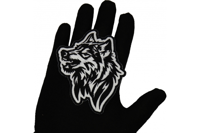 Tribal Wolf Snaring Patch shown on hand for size comparison