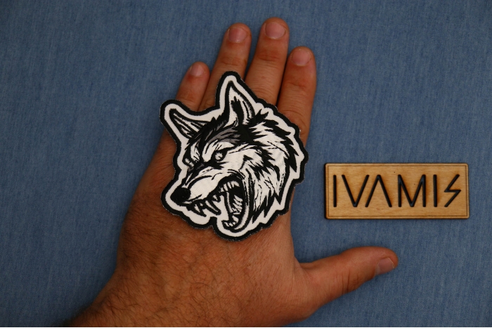 Vicious Tribal Wolf Patch shown on hand for size comparison