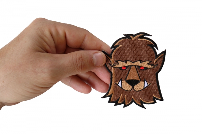 Wacky Wolf Iron on Patch shown on hand for size comparison