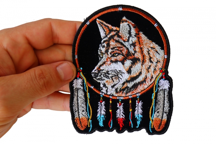 Wolf Patch for Jackets shown on hand for size comparison