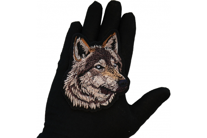 Wolf Patch shown on hand for size comparison
