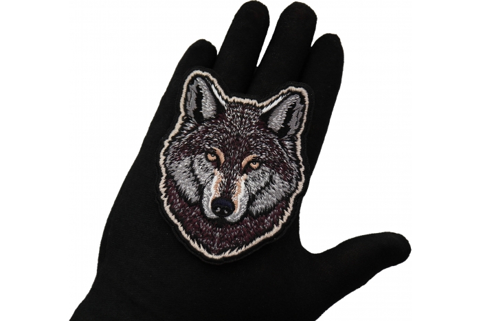 Wolf Patch shown on hand for size comparison