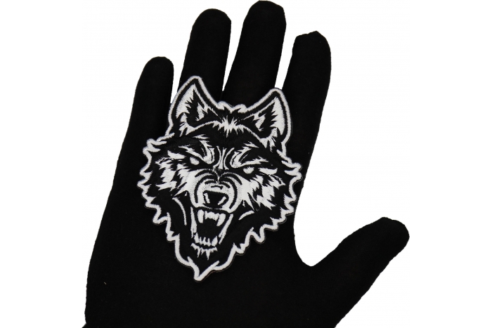 Wolf Stare Patch shown on hand for size comparison