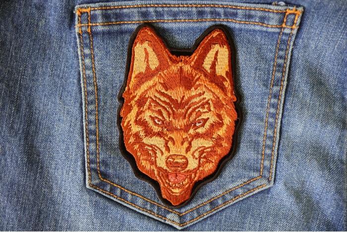 Brown Wolf Patch shown on jeans