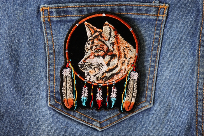 Wolf and Feathers Small Patch shown on jeans