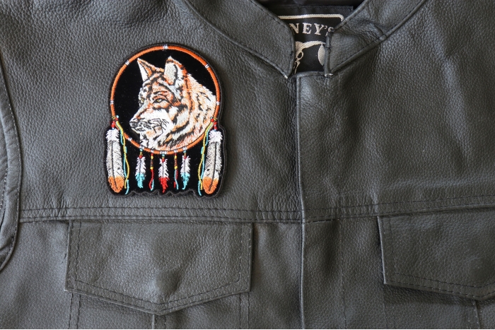Wolf and Feathers Small Patch - 3.5x4.4 inch - Embroidered Iron on Patch shown on leather vest