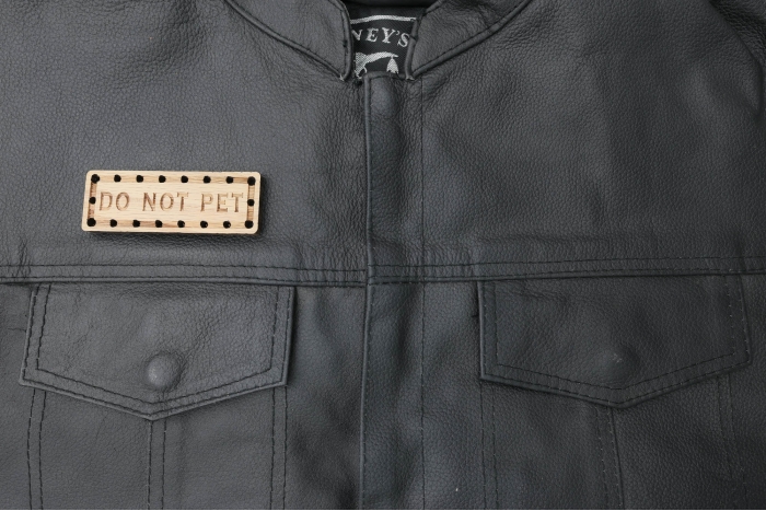 Do Not Pet Oak Wood Patch shown on leather vest