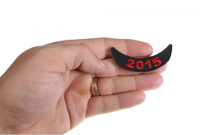 2015 Red Lower Rocker Patch shown on hand for size comparison