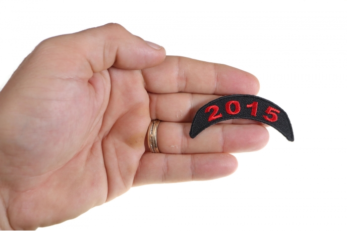 2015 Red Upper Rocker Patch shown on hand for size comparison