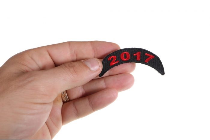 2017 Red Upper Rocker Patch shown on hand for size comparison