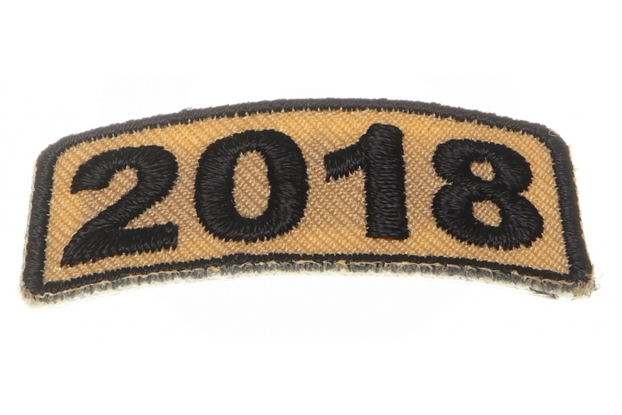 2018 Patch in Brown shown on hand for size comparison