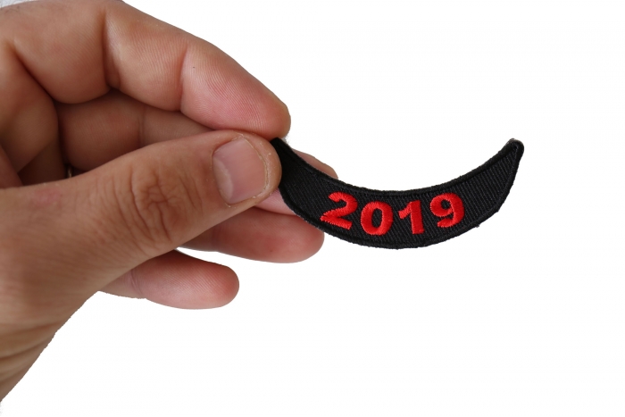 2019 Lower Rocker Red Patch shown on hand for size comparison