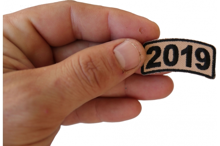 2019 Rocker Patch Tan shown on hand for size comparison