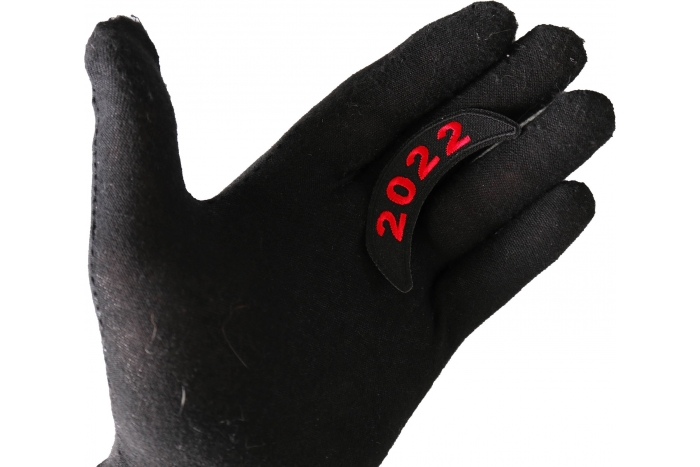 2022 Red Upper Rocker Year Patch shown on hand for size comparison