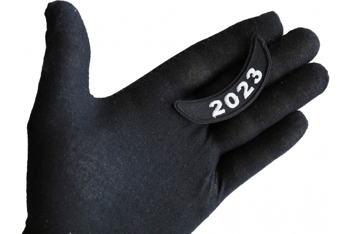 2023 Year Patch Lower Rocker White shown on hand for size comparison