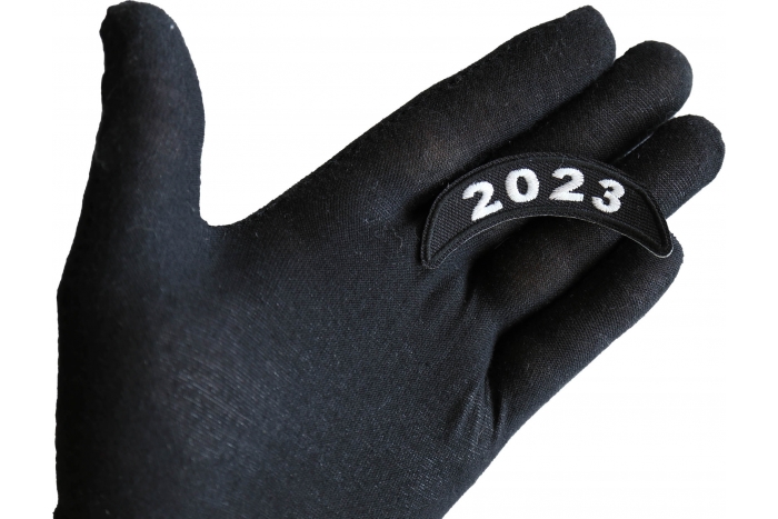 2023 Year Patch Upper Rocker White shown on hand for size comparison