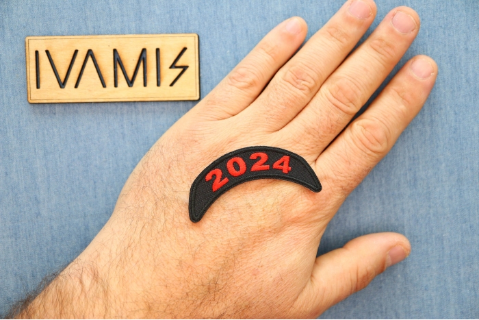 2024 Patch Upper Rocker Red shown on hand for size comparison