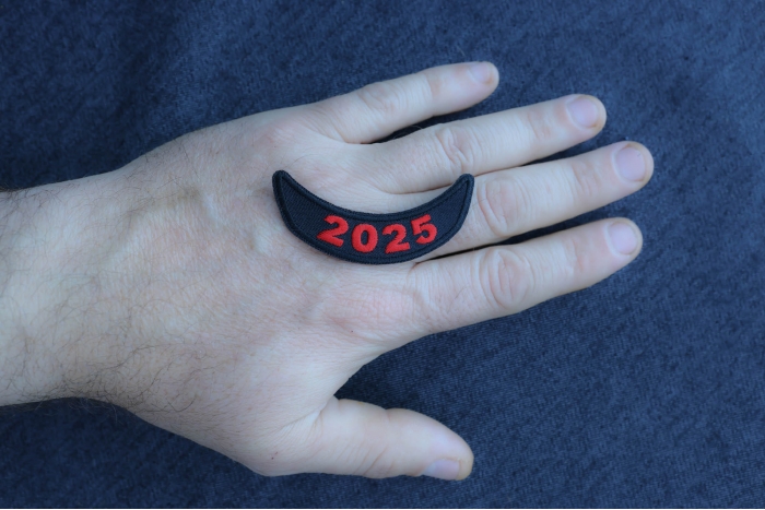 2025 Patch Lower Rocker Red shown on hand for size comparison