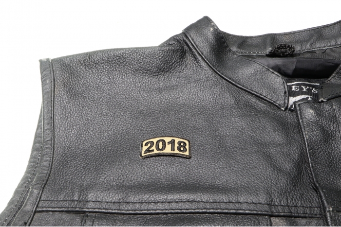 2018 Patch in Brown - 1.6x0.75 inch. Embroidered Iron on Patch shown on leather vest