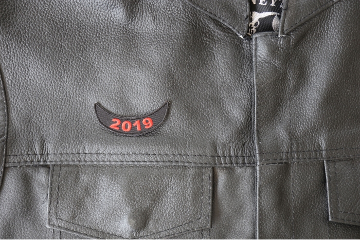 2019 Lower Rocker Red Patch - 2.5x1 inch - Embroidered Iron on Patch shown on leather vest