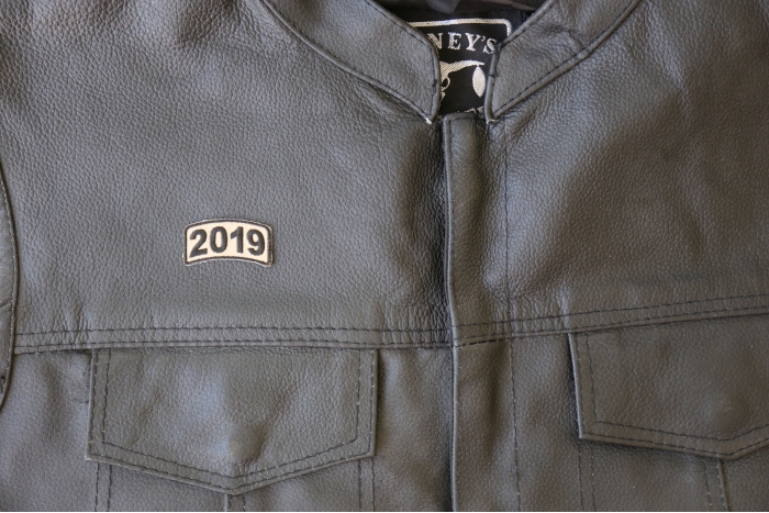 2019 Rocker Patch Tan - 1.6x0.75 inch - Embroidered Iron on Patch shown on leather vest