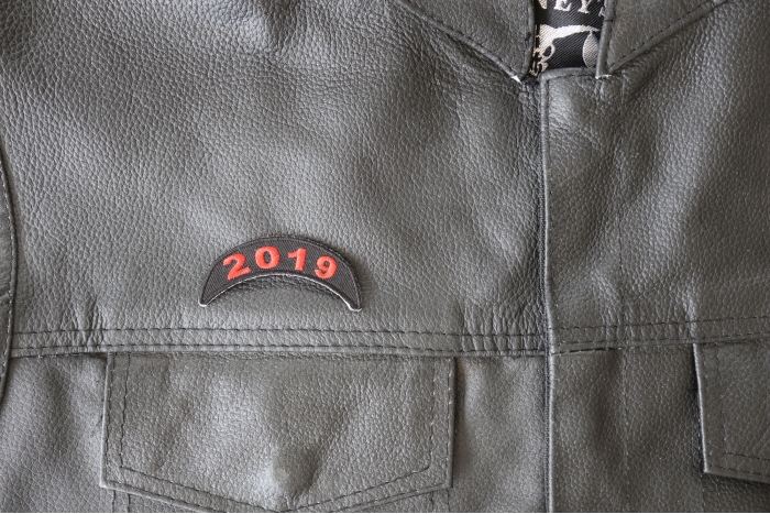 2019 Upper Rocker Red Patch - 2.5x1 inch - Embroidered Iron on Patch shown on leather vest