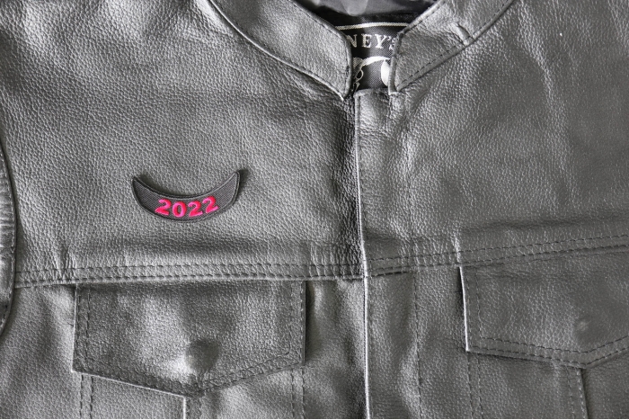 2022 Red Lower Rocker Year Patch - 2.5x1 inch - Embroidered Iron on Patch shown on leather vest