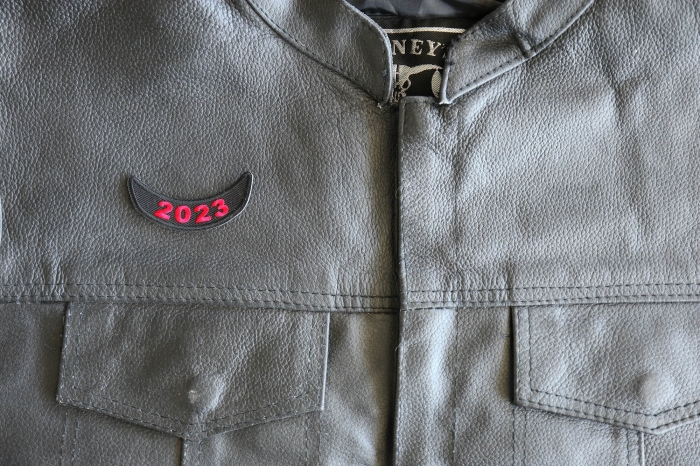 2023 Year Patch Lower Rocker Red - 2.5x1 inch - Embroidered Iron on Patch shown on leather vest