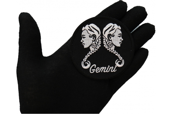 Gemini zodiac sign shown on hand for size comparison