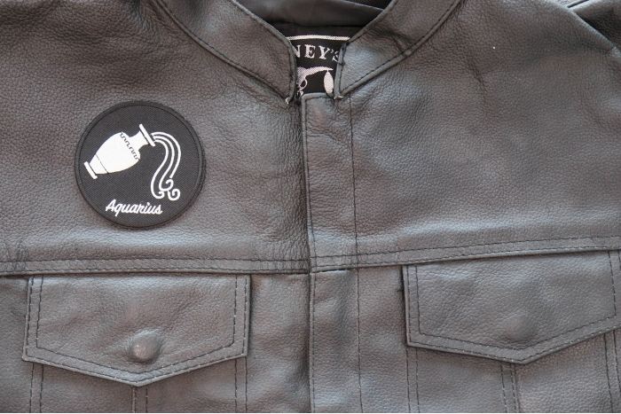 Aquarius Patch - Iron on - Embroidered shown on leather vest